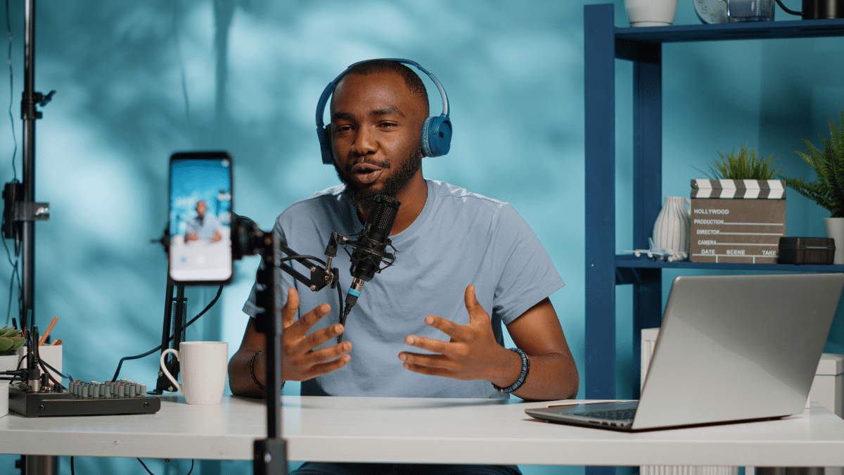 Dream collab — a podcaster recording with headphones and microphone